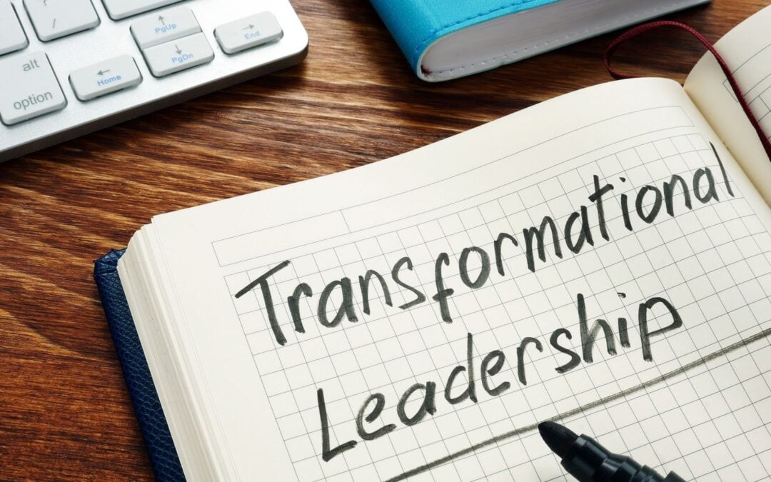 Transformational leadership handwritten in a note pad.